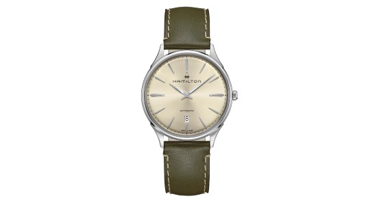 A minimalistic Hamilton watch with a beige dial and green strap, available at Windsor Jewelers.