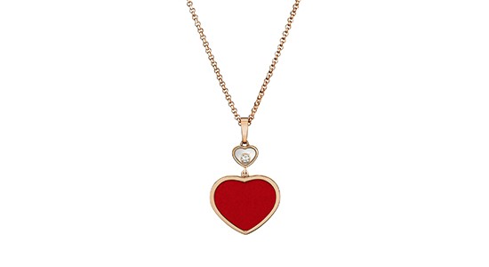 A gold necklace featuring a red heart pendant, available at Windsor Jewelers.