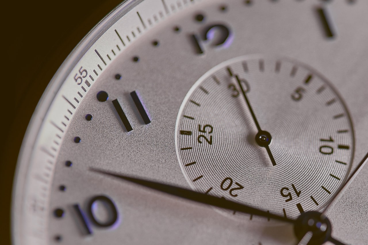 A close-up of a luxury watch face with a chronograph.